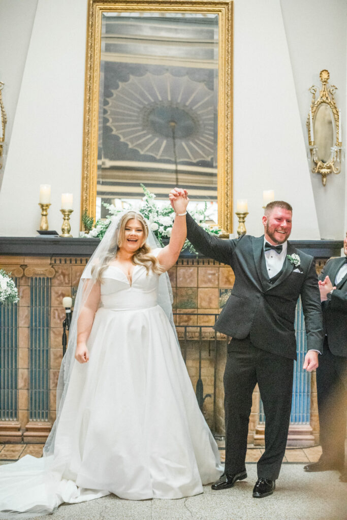 Bride and groom just married in Montana wedding venue with indoor ceremony.
