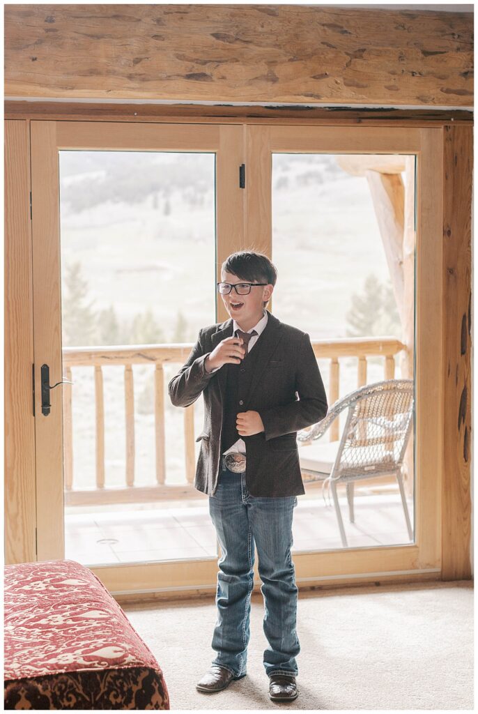 Son of bride waiting for his mother on wedding day.