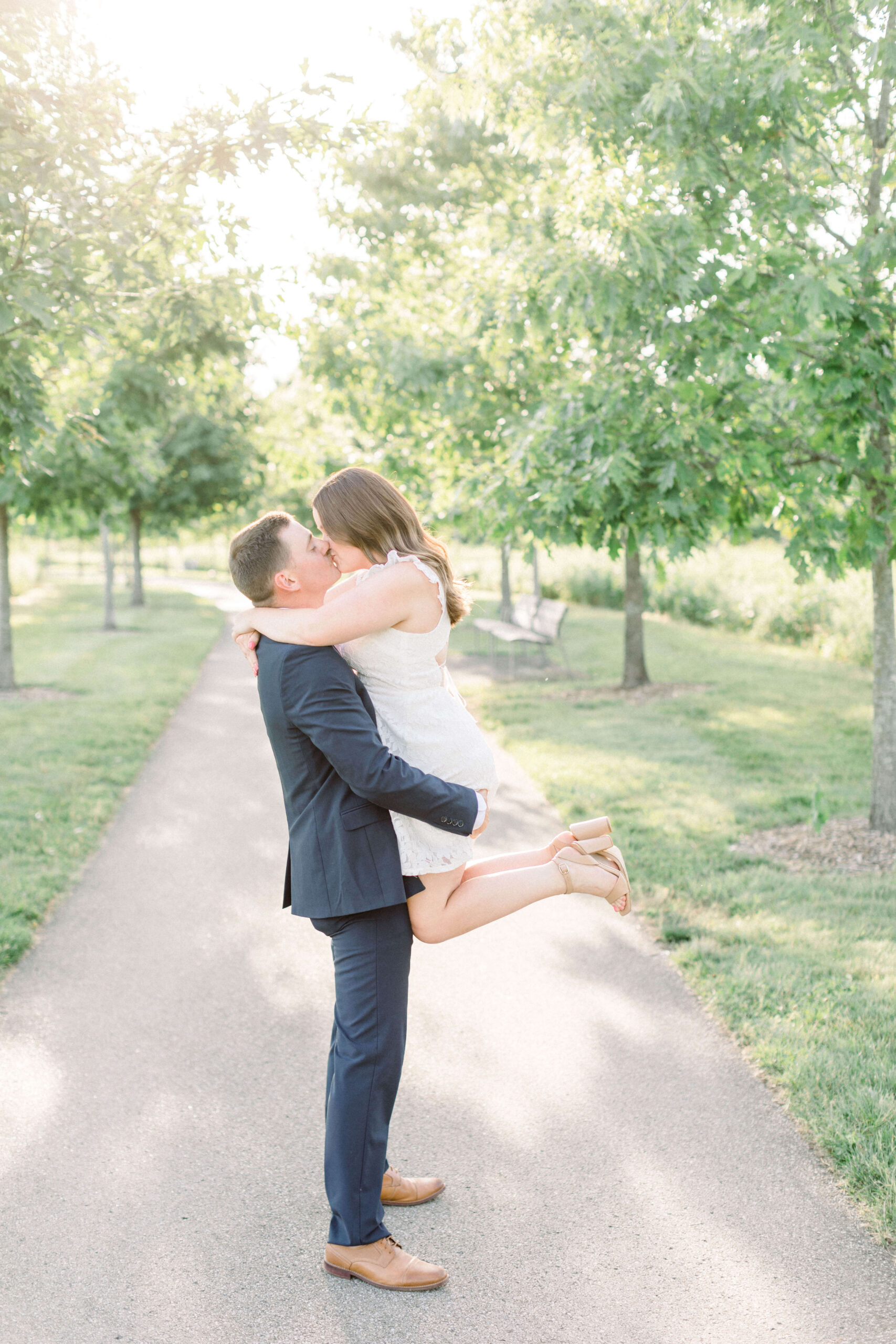 Engagement couple kissing for Bozeman engagement photography in a park.