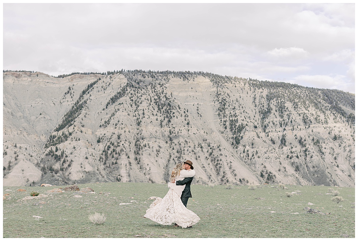 Couple spinning for portraits in Yellowstone National Park.